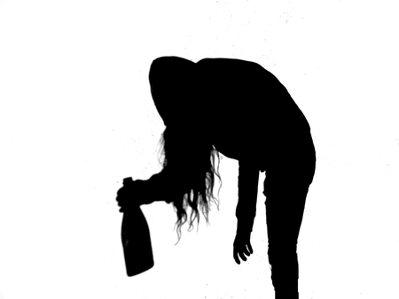 Silhouette of young alcoholic women with alcohol bottle, alcohol addictionの写真素材