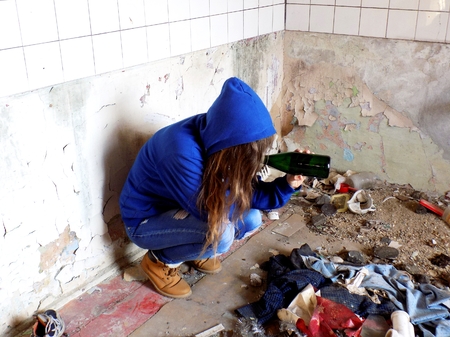 Young alcoholic women with alcohol bottle, alcohol addictionの写真素材