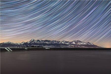 The night sky over one hour exposure to the beauty of the mountain