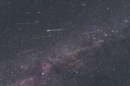 Meteor swarm of Perseids in the night sky with the Milky Way, August 2021