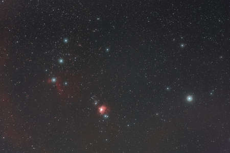 Orion constellation and red nebula in the night sky