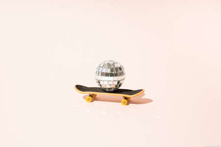Disco ball on skateboard. Mininmal concept.の写真素材