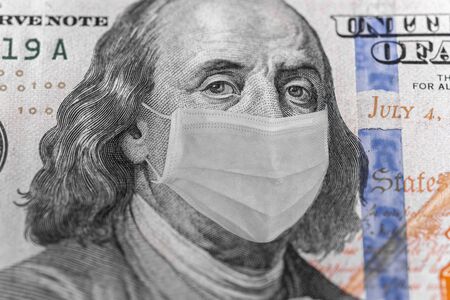 Photo illustration of Ben Franklin in a mask on a dollar 100 bill. Displays problems in the world...