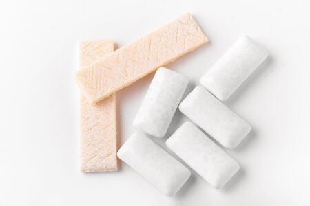 Chewing gum top view macro photography on a white background. A lot of gum is scattered on the table.の写真素材