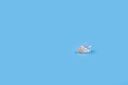 A lan connector close up isolated in blue background. Copy space. Space for text.