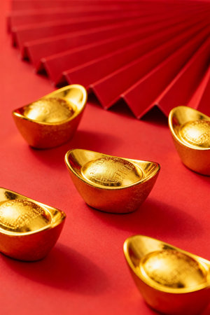 Chinese new year gold ingots on red background. Chinese new year concept.の素材