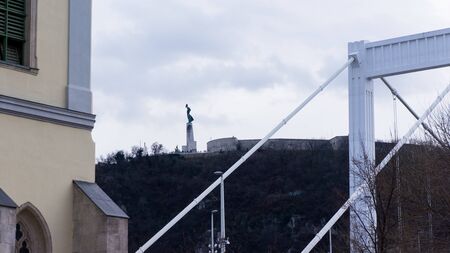detail of the Elisabeth Bridge in the background of the Statue of Libertyの写真素材