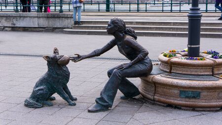 Budapest, Hungary 03 15 2019 Dog girl statue. Statue of David Raffay set up in 2007 in VÃ­gadÃ³ Square, Budapestのeditorial素材