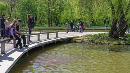 Debrecen Hungary 04 19 2019 young couple eating fish in Debrecen in the Great Forest park.のeditorial素材