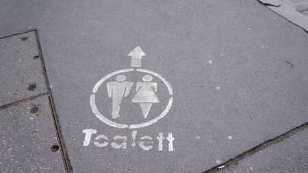 direction sign for toilettes with male and female signの写真素材