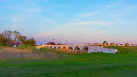 The famous nine hole bridge at sunset Hortobagy, Hungaryの写真素材