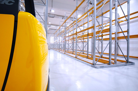 Warehouse view with forklift truck portion on the leftの写真素材