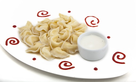 meat dumplings on a plate on white backgroundの写真素材