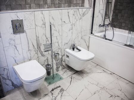 Photo toilet and bidet in the bathroomの写真素材
