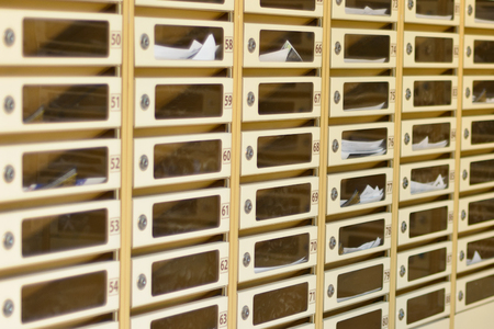 the post cubicle of an apartment building, with daily mail