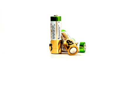 Several spent color alkaline batteries on a white background. Russia, Volgograd, August 19, 2018のeditorial素材