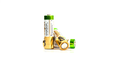 Several spent color alkaline batteries on a white background. Russia, Volgograd, August 19, 2018のeditorial素材