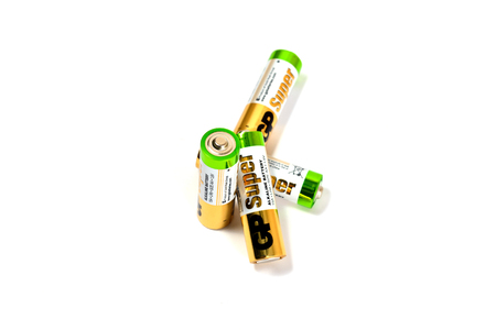 Several spent color alkaline batteries on a white background. Russia, Volgograd, August 19, 2018のeditorial素材