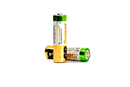 Several spent color alkaline batteries on a white background. Russia, Volgograd, August 19, 2018のeditorial素材