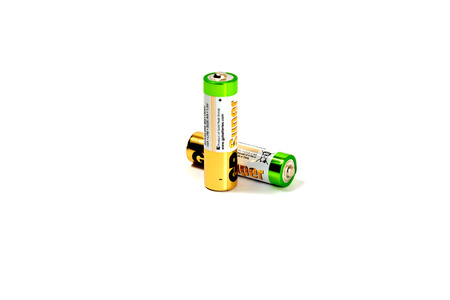 Several spent color alkaline batteries on a white background. Russia, Volgograd, August 19, 2018のeditorial素材
