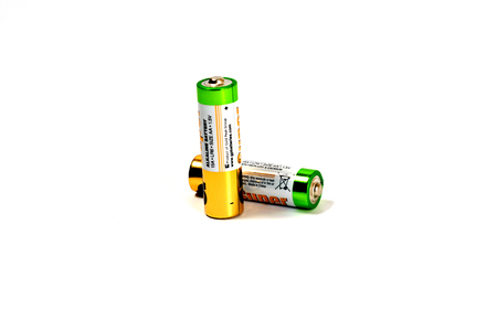 Several spent color alkaline batteries on a white background. Russia, Volgograd, August 19, 2018のeditorial素材