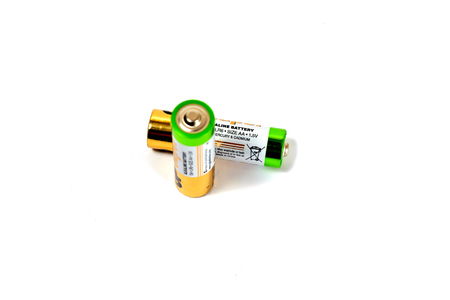 Several spent color alkaline batteries on a white background. Russia, Volgograd, August 19, 2018のeditorial素材