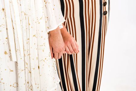 The hands of young girls are tenderly folded together as a symbol of same-sex love for each other. ...