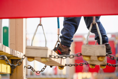 children play on the playground. early spring.の写真素材