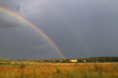 Hope on the road in form of rainbow.の写真素材