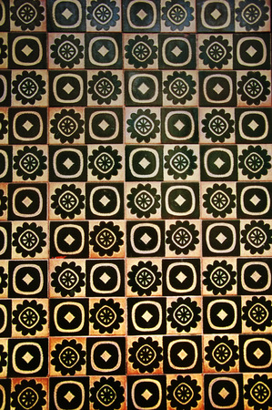 Yellow and black tile with different pattern, wall in Spainの写真素材