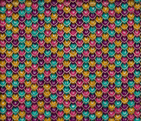 Violet, yellow, pink and turquoise fluffy snake skin with golden borders, long sharp scale. Fashionable print. Fashion and stylish background.の写真素材