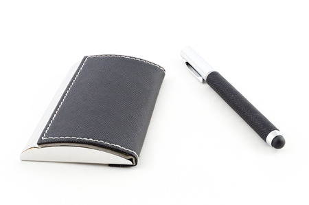 Visit card holder and pen isolated on white backgroundの写真素材