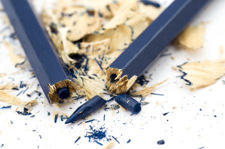 Blue broken pencil and shavings isolated on white backgroundの写真素材