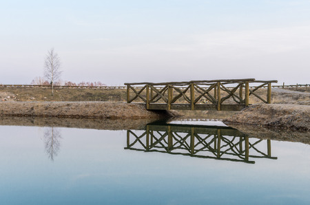 Bridge reflection in water  Early spring eveningの写真素材