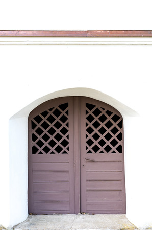 Old carved wooden doors into the chapelの写真素材