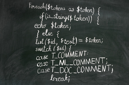 A detail of computer code in PHP explained with white chalk