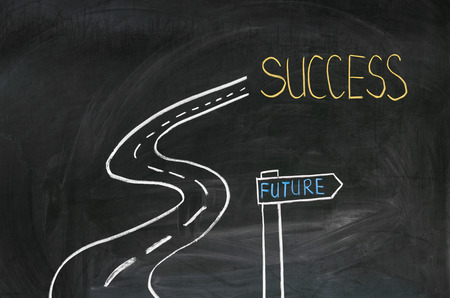 With chalk on the blackboard painted road to successの写真素材