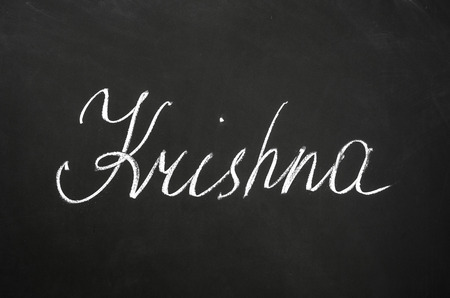 The word Krishna write on the blackboard.