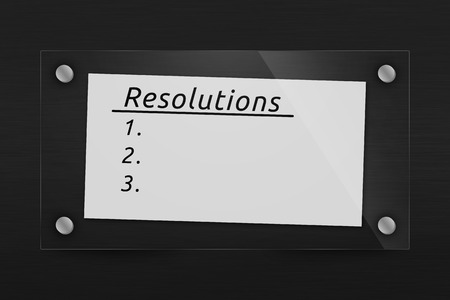 Behind glass sheet of paper with a list of resolutionsの写真素材