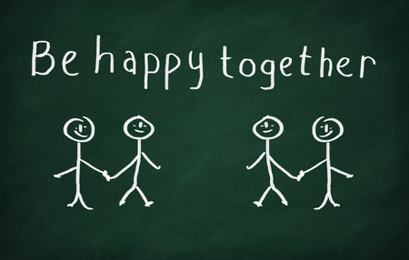 On the blackboard draw several characters and write Be happy togetherの写真素材