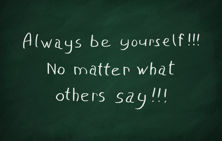 On the blackboard with chalk write Always be yourself. No matter what other says.の写真素材