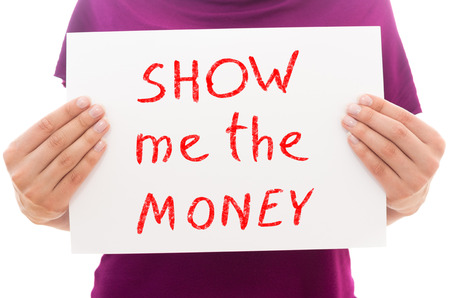 Girl holding white paper sheet with text Show me the moneyの写真素材