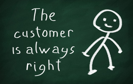 On the blackboard draw character and write The customer is always rightの写真素材