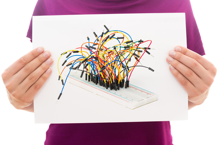 Girl holding white paper sheet with Photo of Breadboardの写真素材
