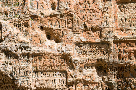 SIGULDA LATVIA - JULY 16 2016: Old inscriptions in the Gautmanis Cave located on the Gauja Riverのeditorial素材