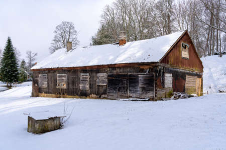 Old barn in the village on a winter dayの写真素材
