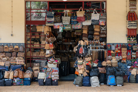 Madeira / Portugal - July 12 2021. Shop selling bags hats and belts at the market area of funchal in...