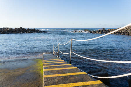 The stairs and sloping for boat. It's entrance to the sea. Madeira island.の写真素材