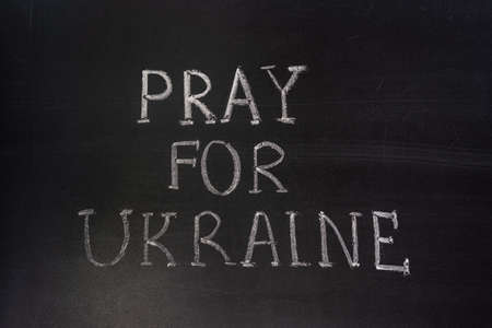 Words "Pray for Ukraine" writed on blackboard with chalkの写真素材