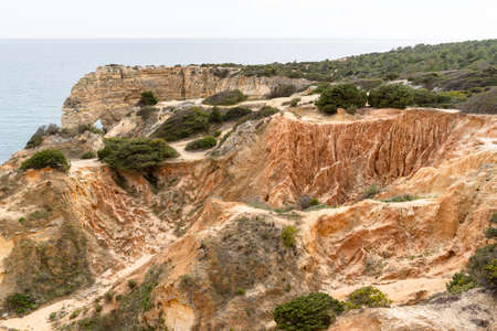 Sea rock arch in Portugal. Landscape of Praia da Marinha in Algarve region, Portugal.